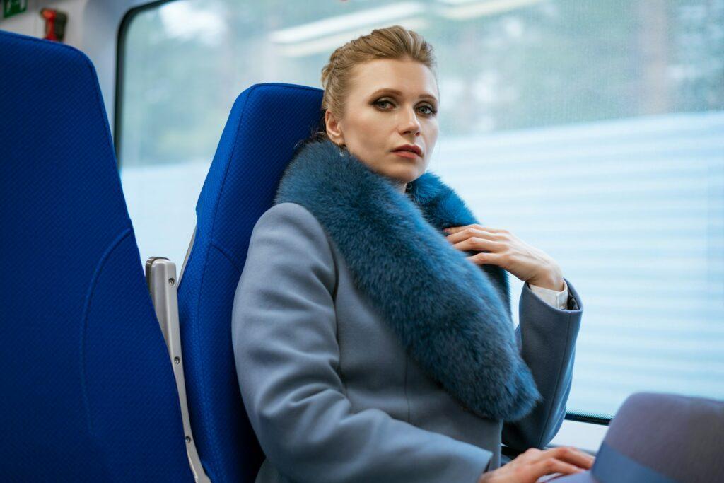 beautiful woman rides in the train looks out the window