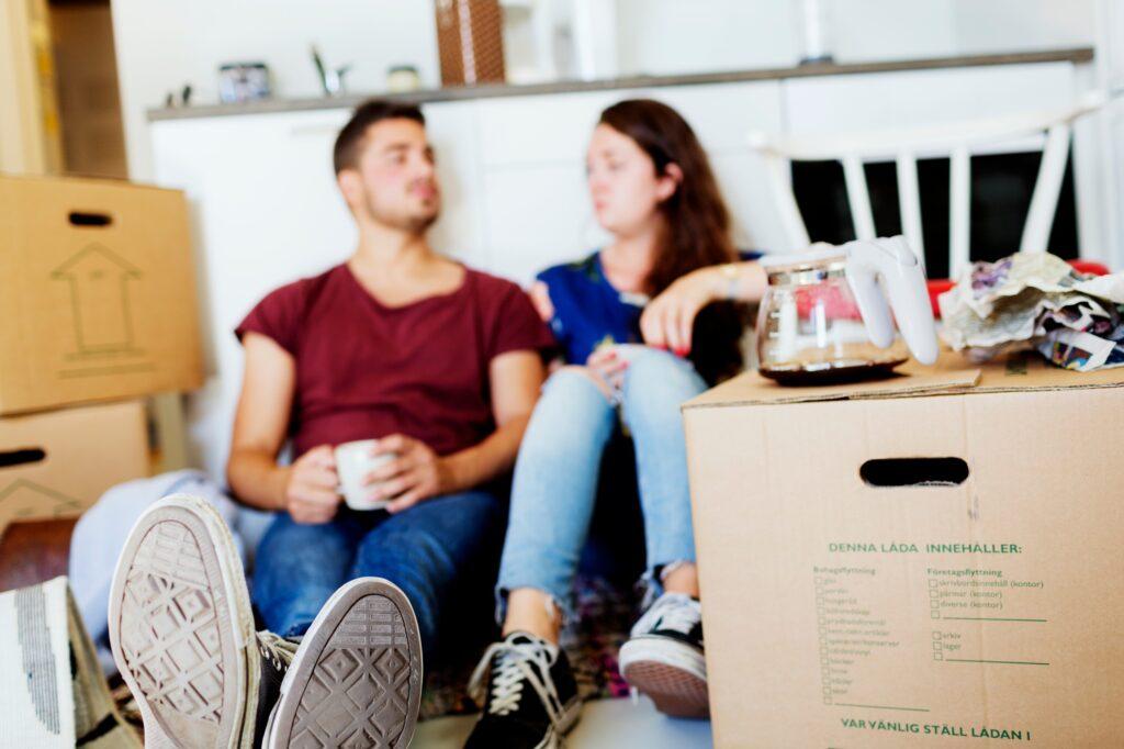 Young Couple taking coffee break in new house